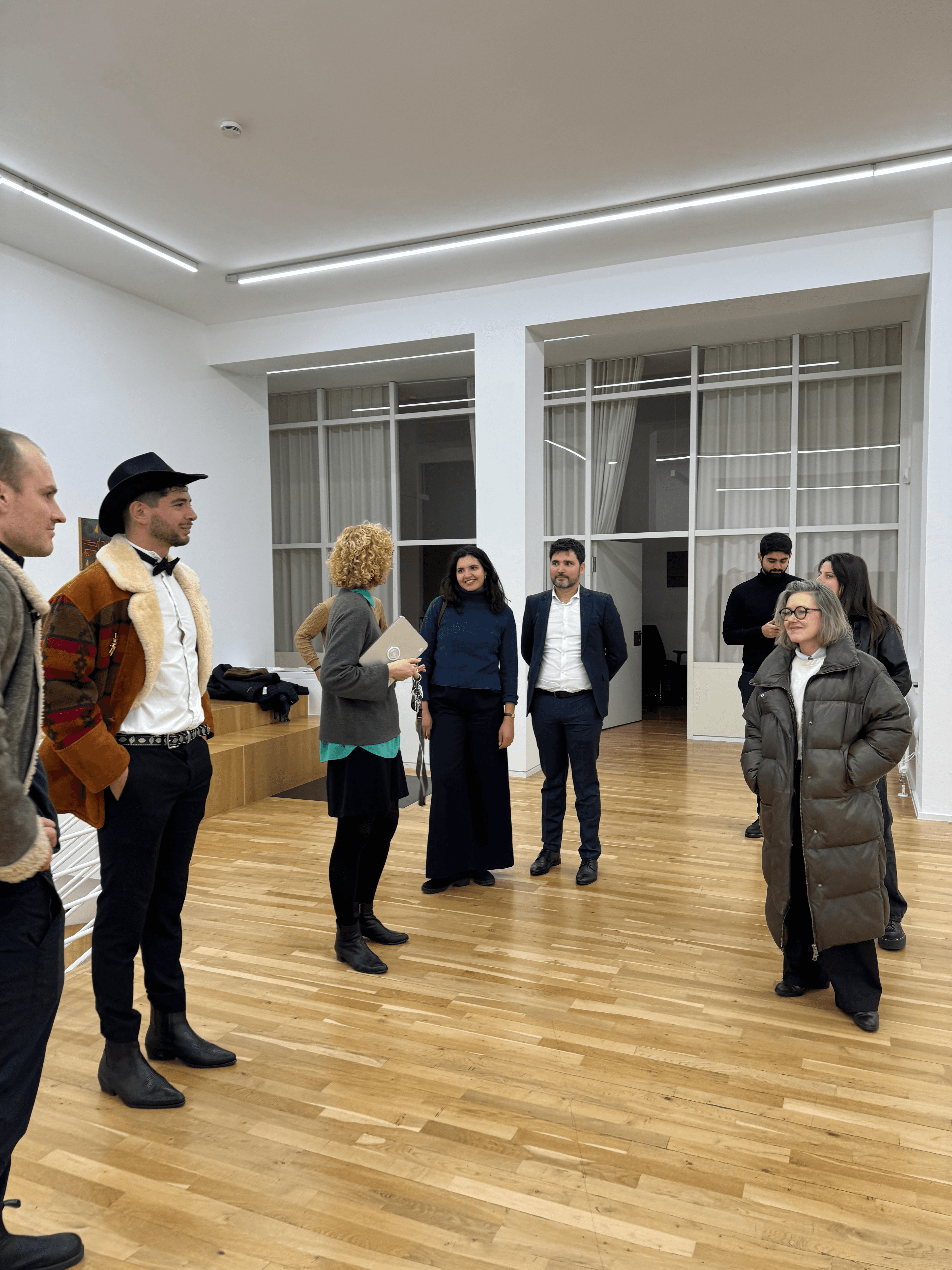 Entrepreneurs engaging in a lively discussion during a Bizz Buzz networking event.