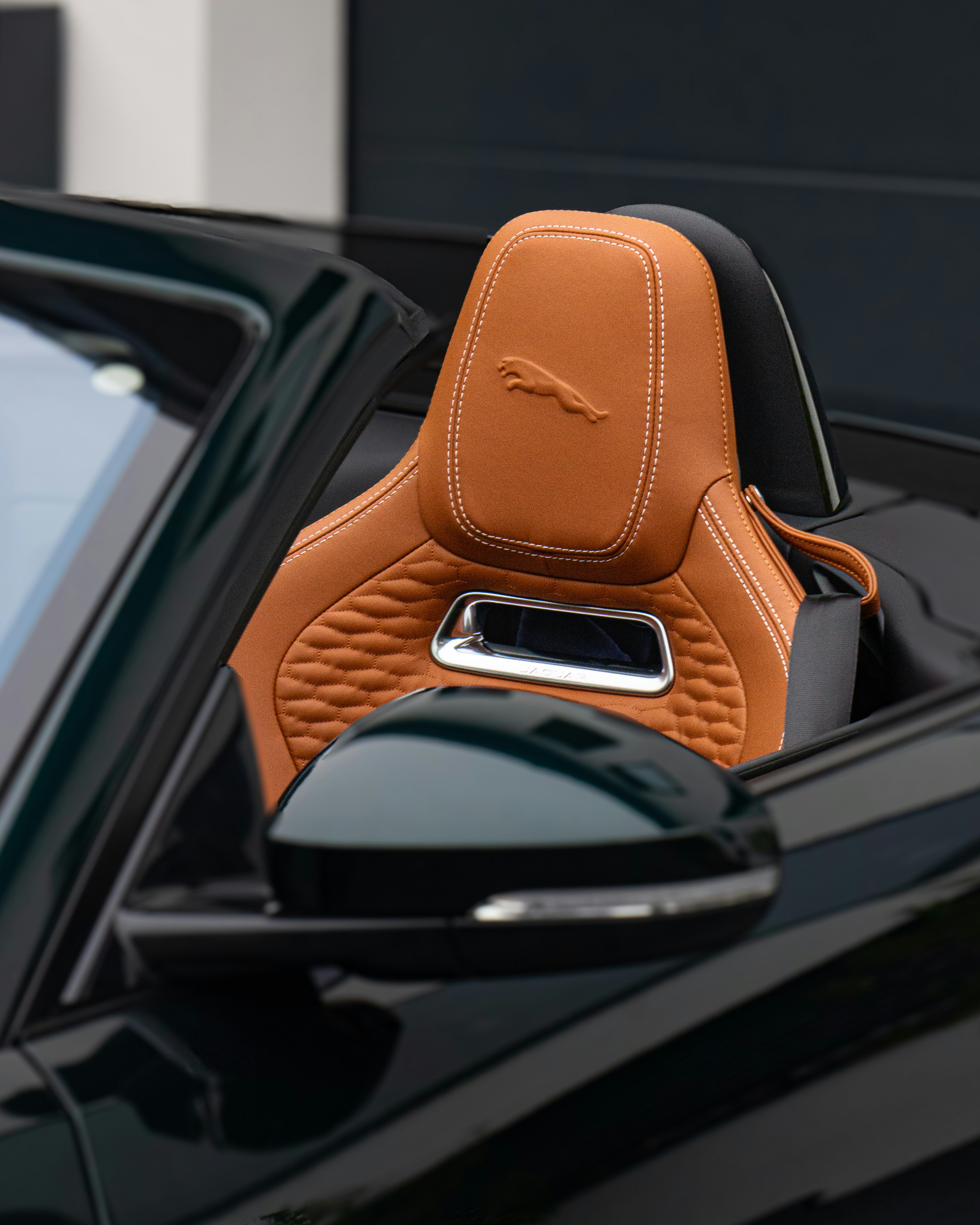 A close up of a car's interior with the door open