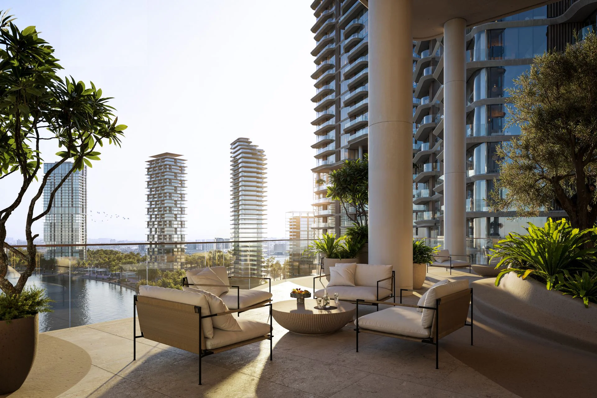 View from a luxury apartment balcony showcasing a city skyline at sunset with vibrant colors and distant mountains.