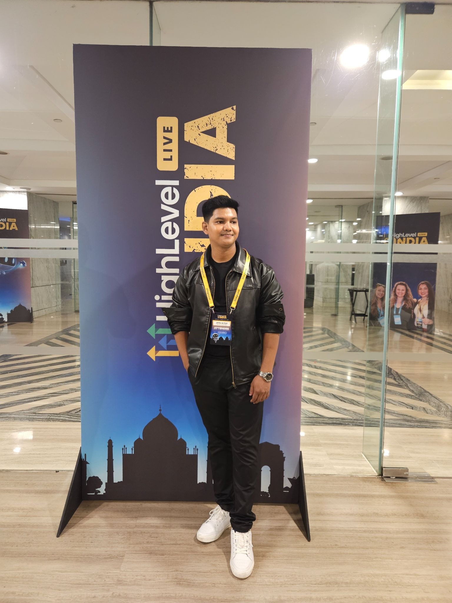 Jiten Sutar at HighLevel India event, standing before conference signage wearing attendee badge.