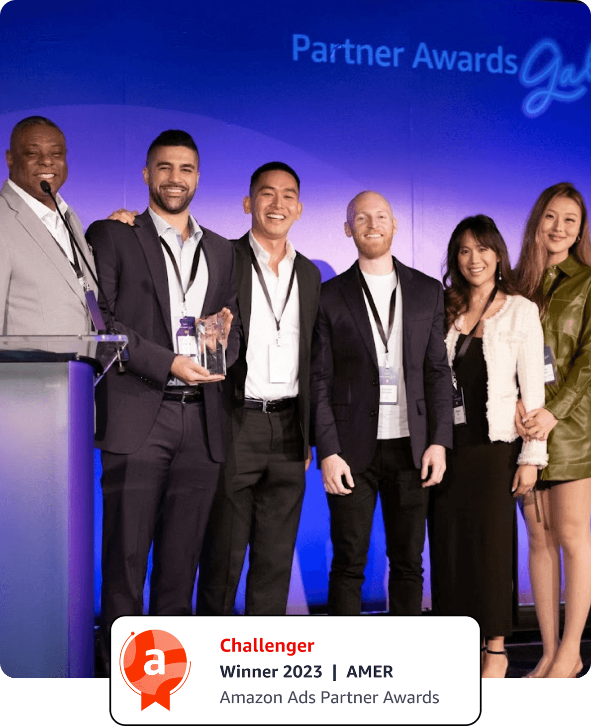 The Lab 916 team accepting the 2023 Amazon Ads Challenger Award on stage at the Partner Awards Gala