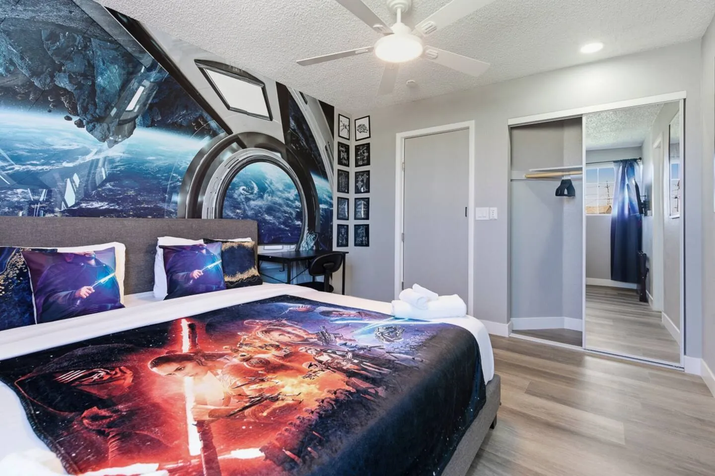 Bedroom with a spaceship mural and space-print bedding, Star Wars Getaway in North Las Vegas