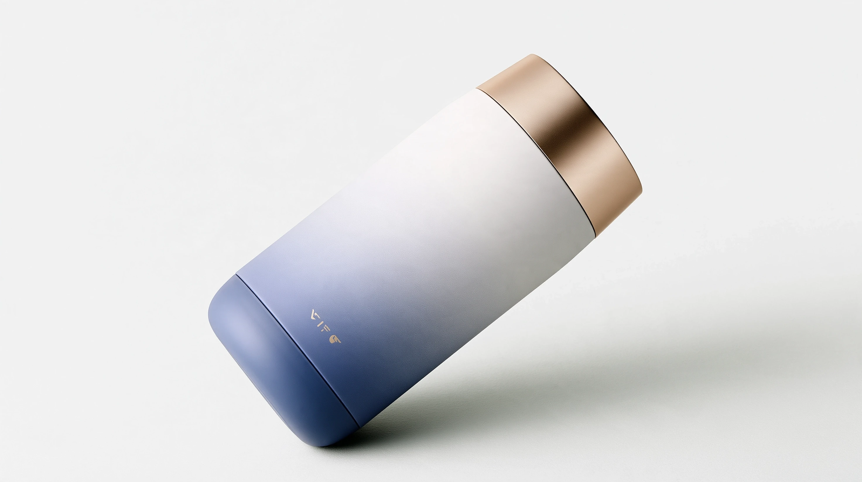 White-to-blue gradient container balanced at an angle, with a gold cap on a pale gray surface.