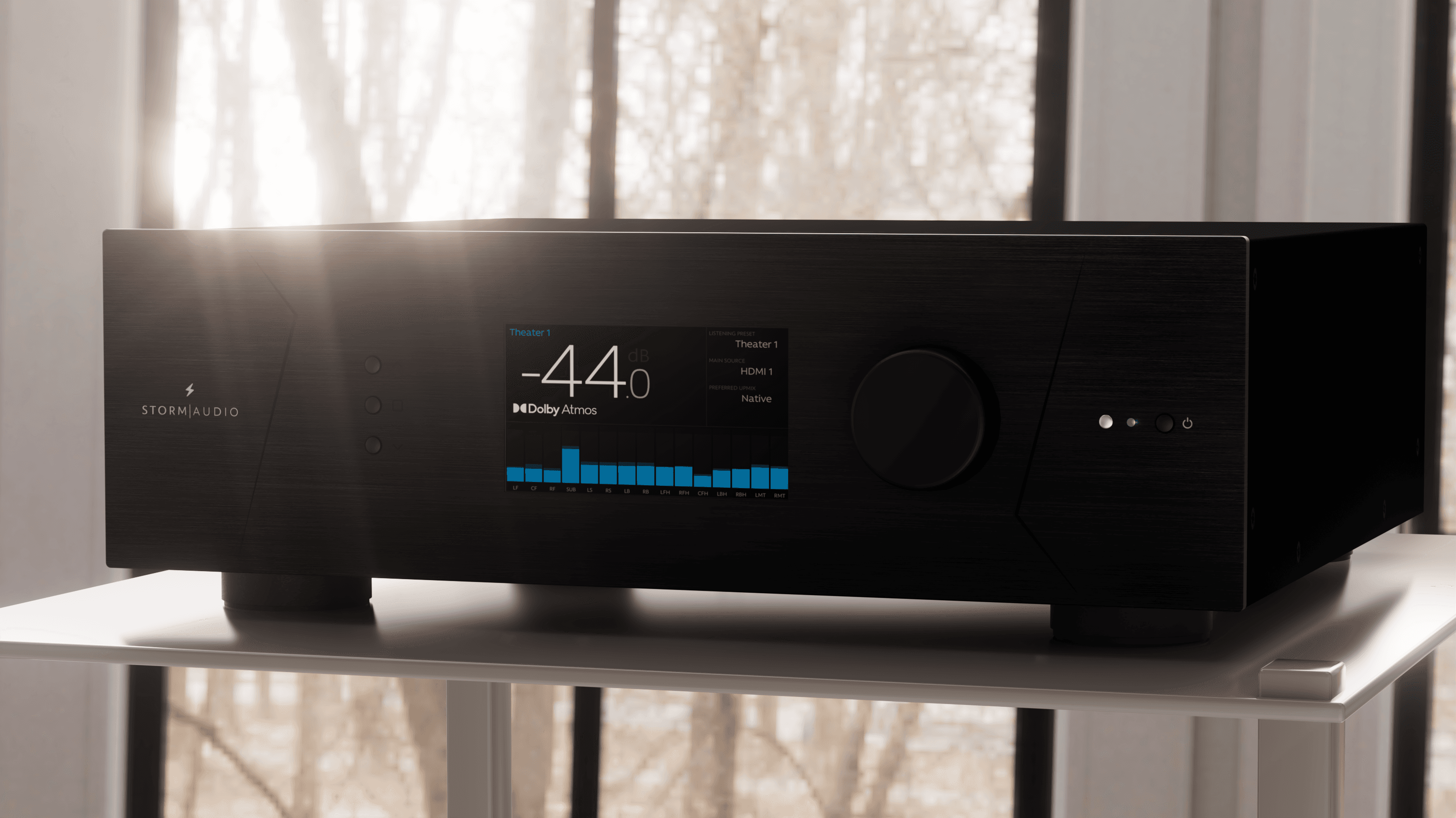 StormAudio AV receiver display showing volume -44dB, Dolby Atmos, and sound level bars.