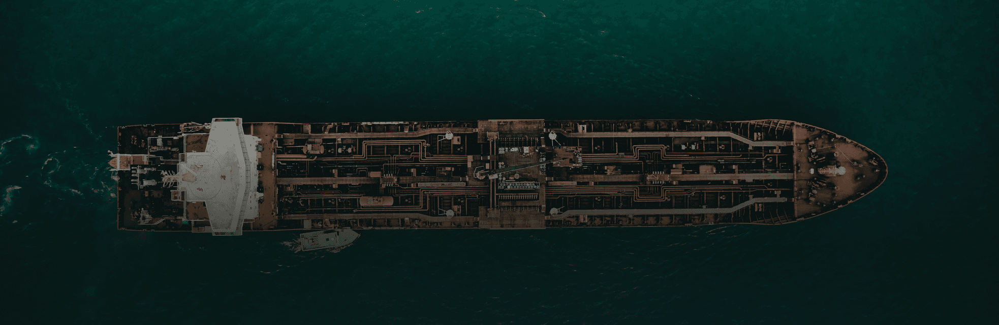 A dark, abstract image with varying tones and a smooth gradient effect, creating a serene atmosphere.