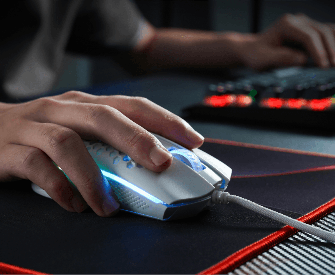 a glowing keyboard and mouse on a desk