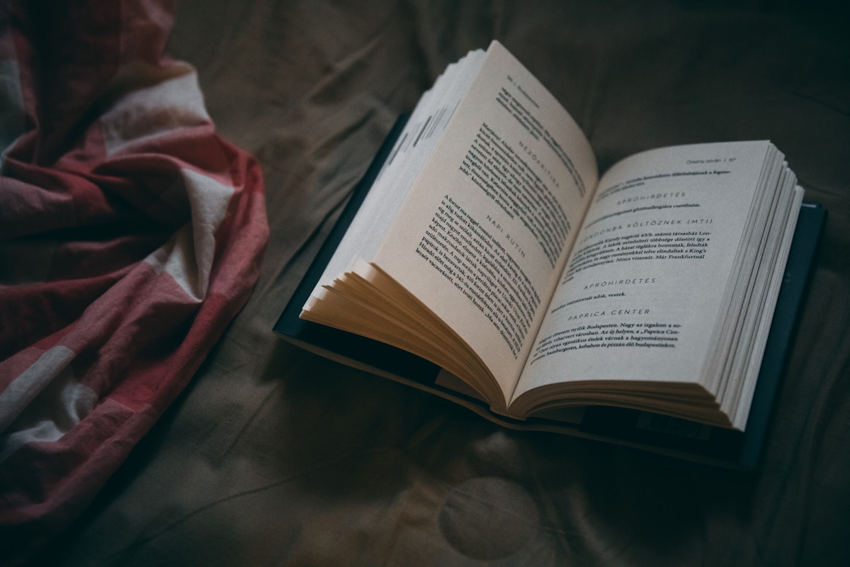 An open book in a calm, dim room
