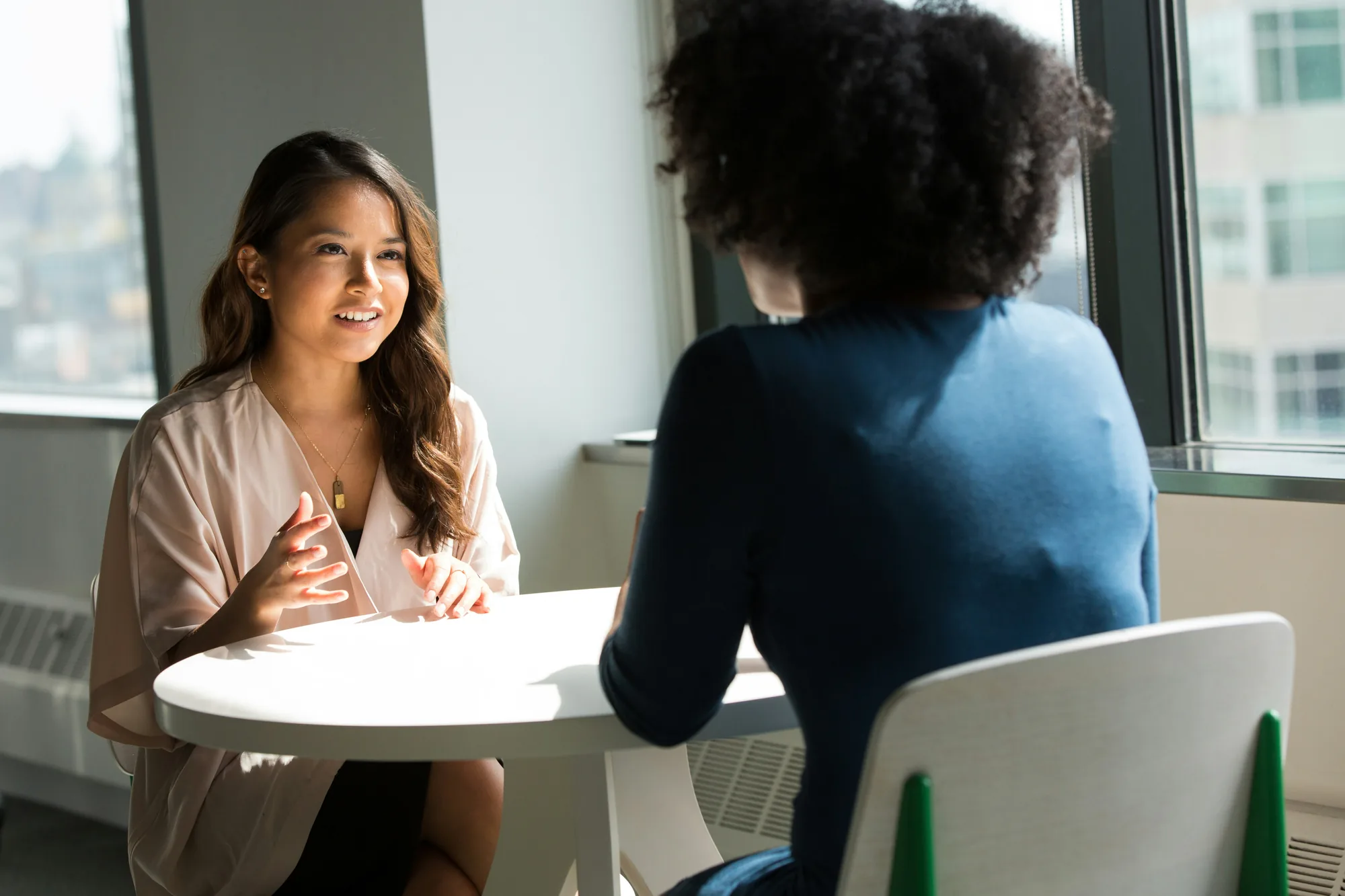 Two women in a client consultation meeting