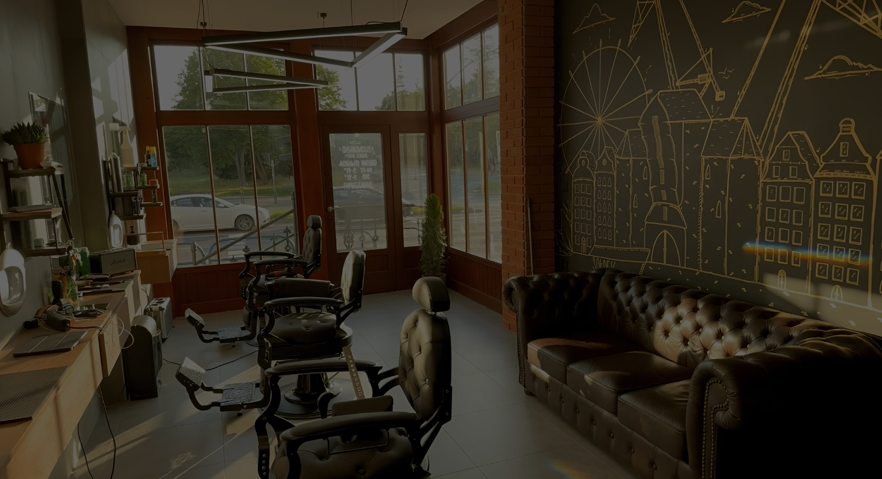 Overhead shot of 2 pizzas and a glass of red wine