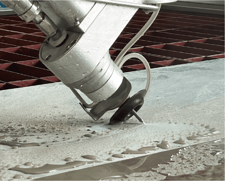 Water jet nozzle cutting through stone with high precision, demonstrating the Dinosaw machine’s efficient cutting technology and ability to handle complex shapes.