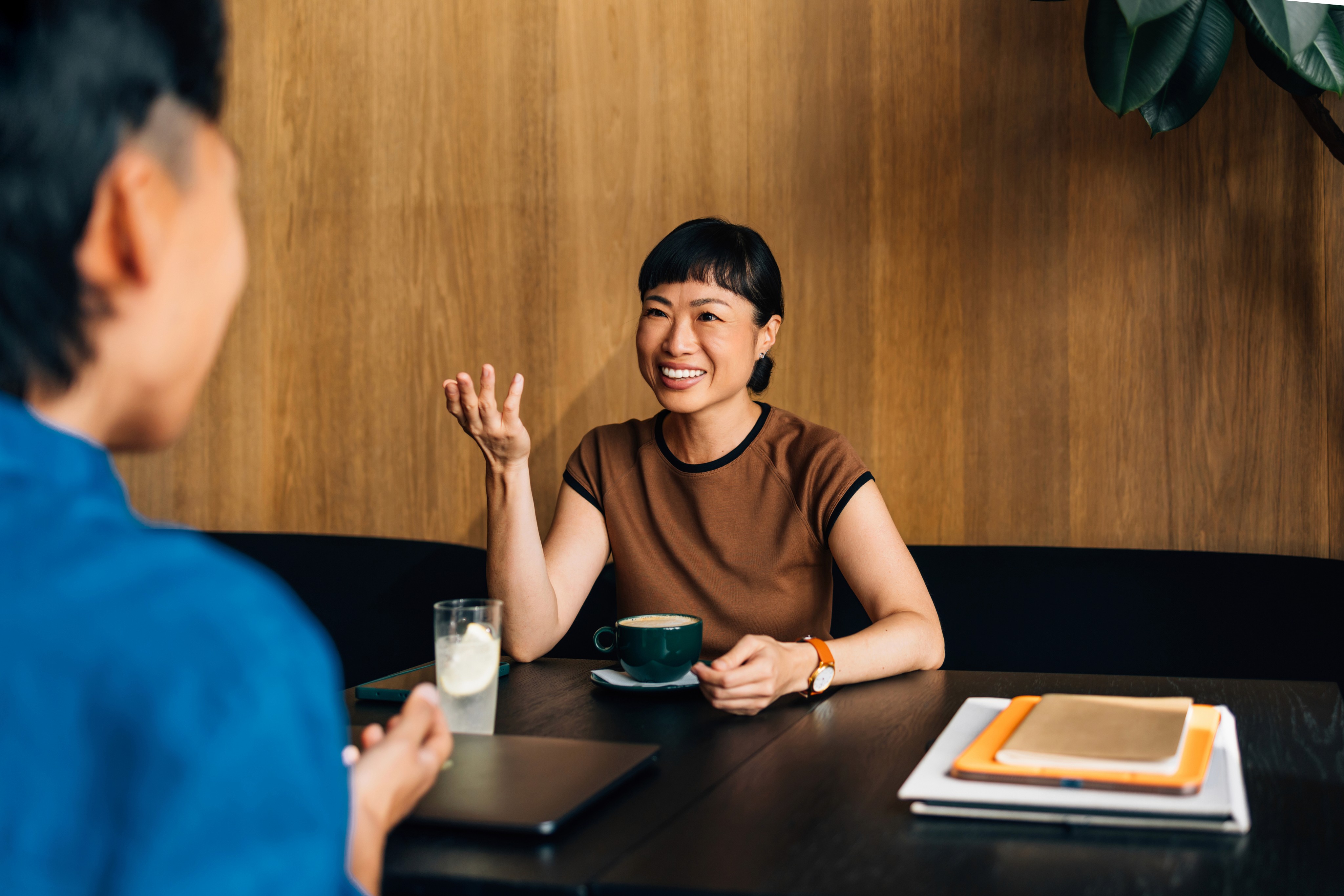EB-1 J1 visa lawyer consulting with colleague using tablet