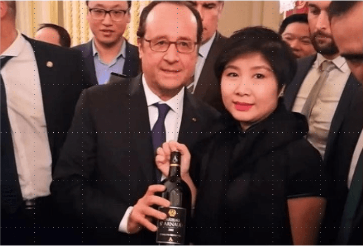 Guests laughing and savoring wine at Elara Vineyard House in Saros