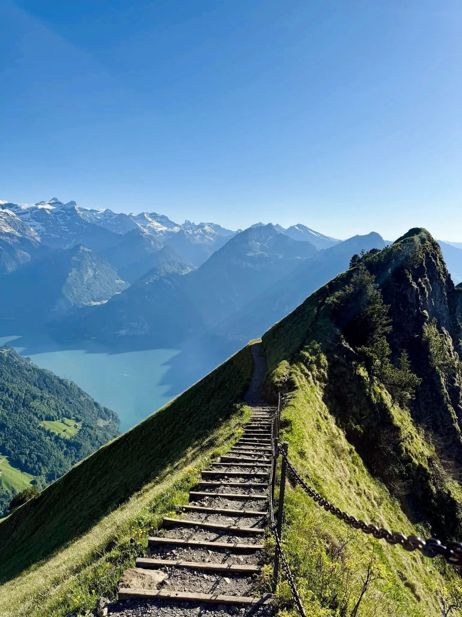 Mountain path above an alpine lake