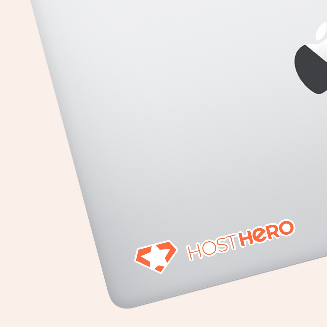 Modern home office setup with a monitor, ergonomic chair, keyboard, and indoor plants near a window with blinds.