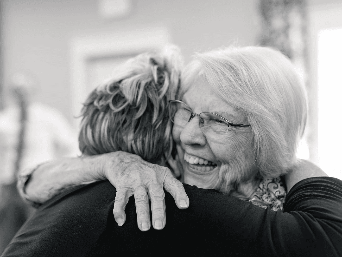Sisters hugging in the church in College Station