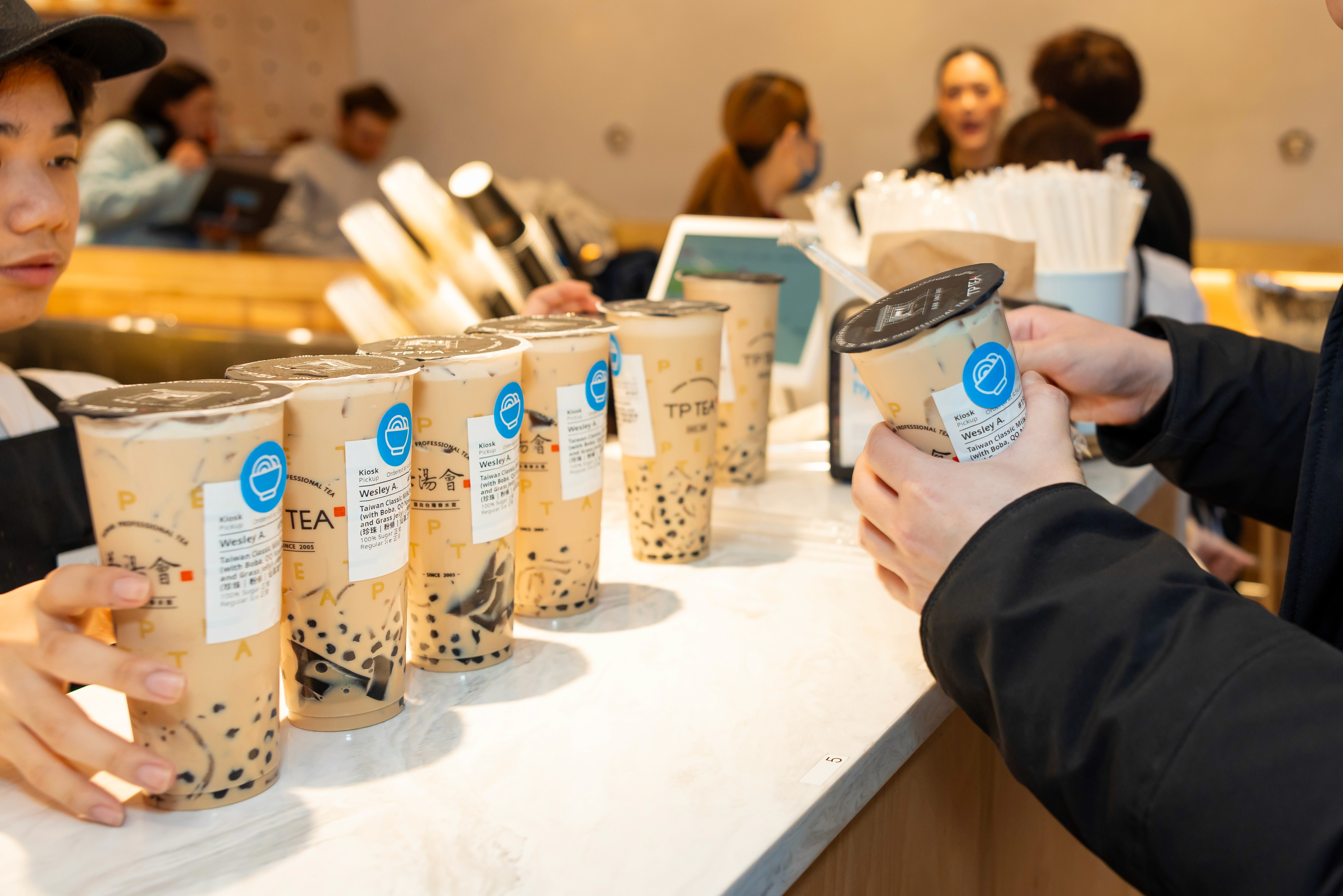 TP Tea kiosk orders lined up with printed digital labels – example of streamlined POS pickup using Snackpass