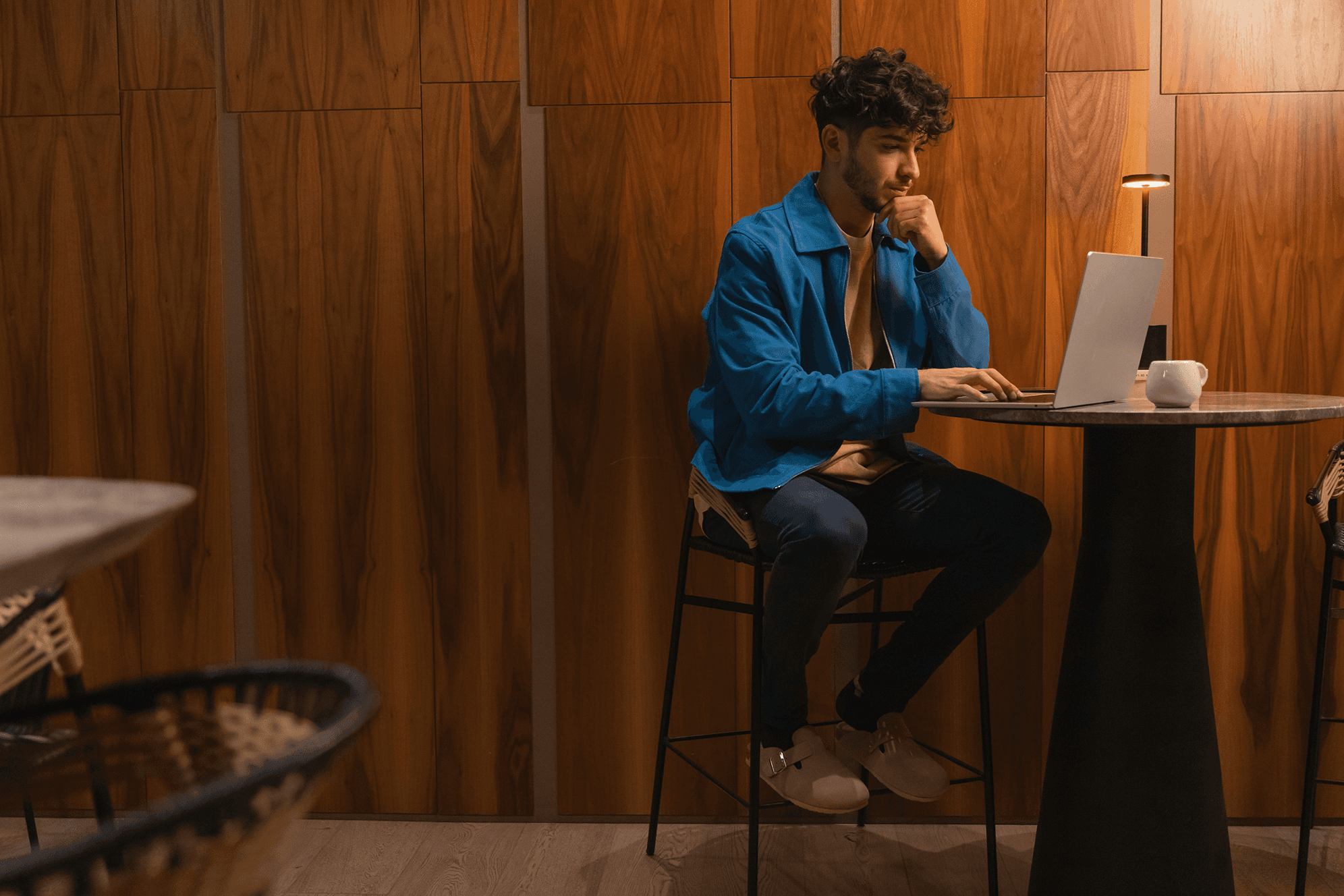Man who is observing his spening pattern on the laptop