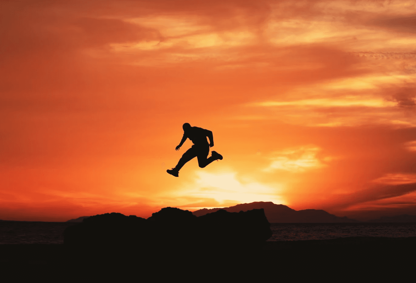 Man jumping over a hill