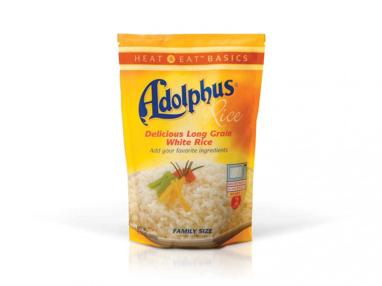 Rustic cabin in a golden field at sunset