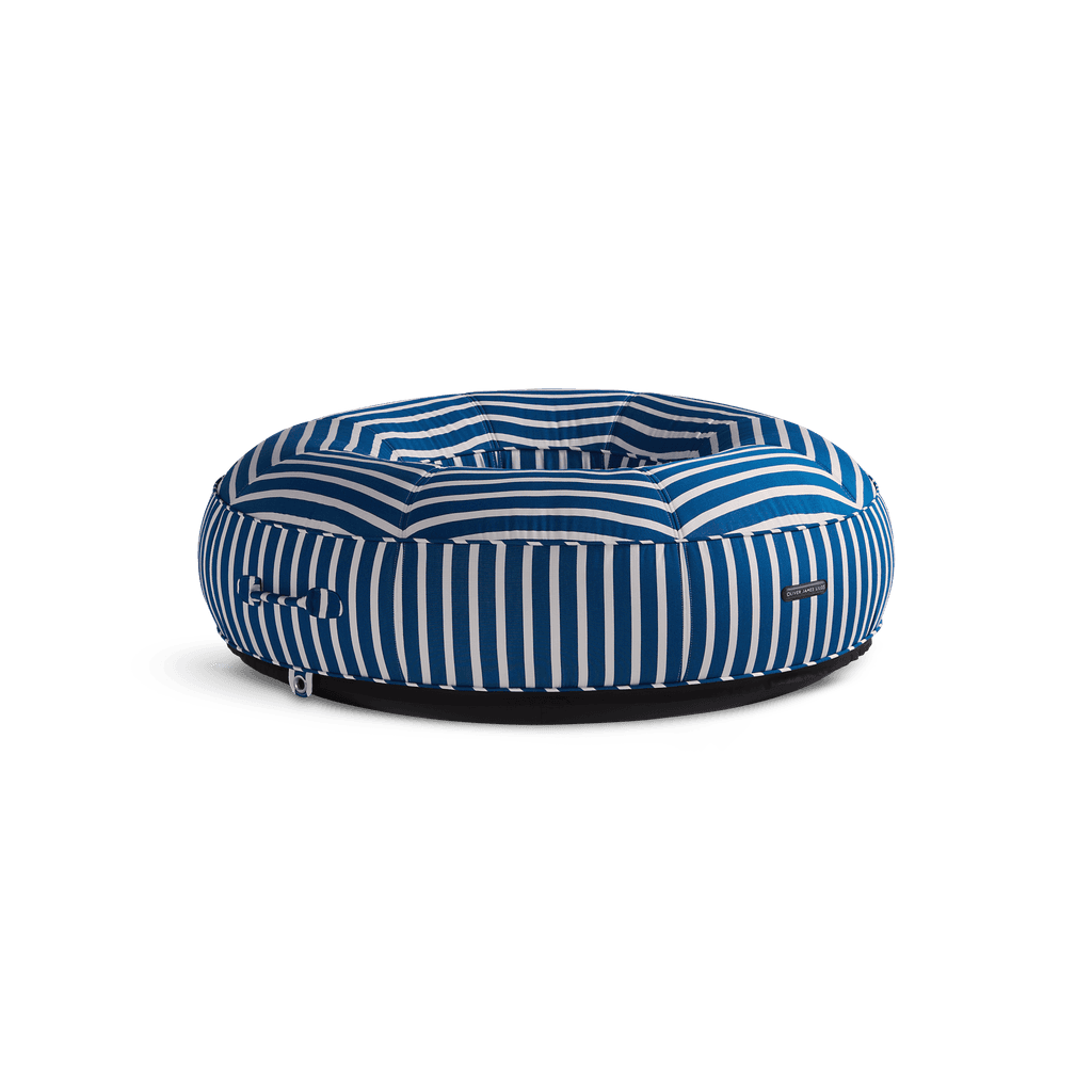 Ring-shaped luxury pool float in blue-and-white stripe canvas with quilted panels and jet-black base