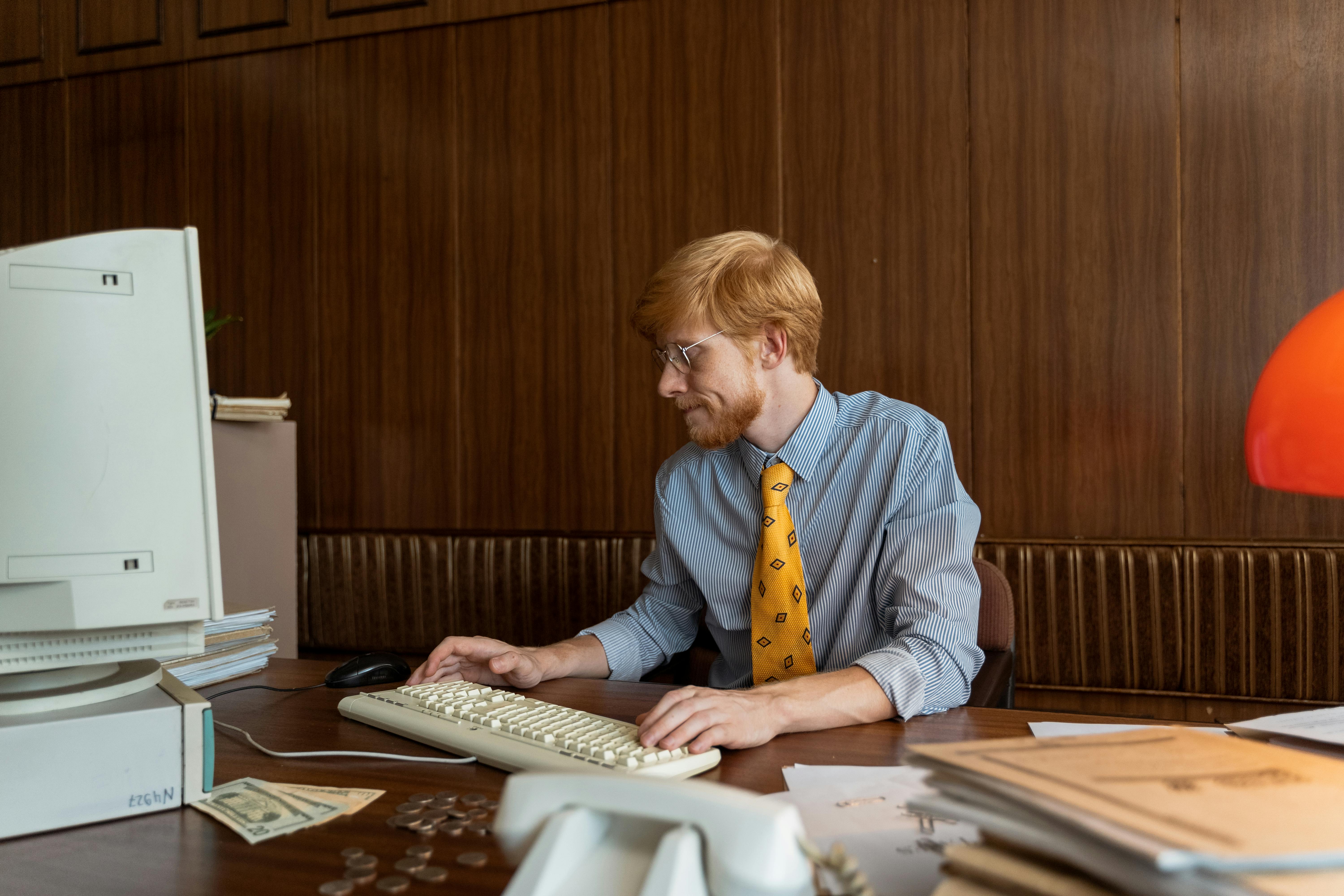 Man researching broker fees on computer