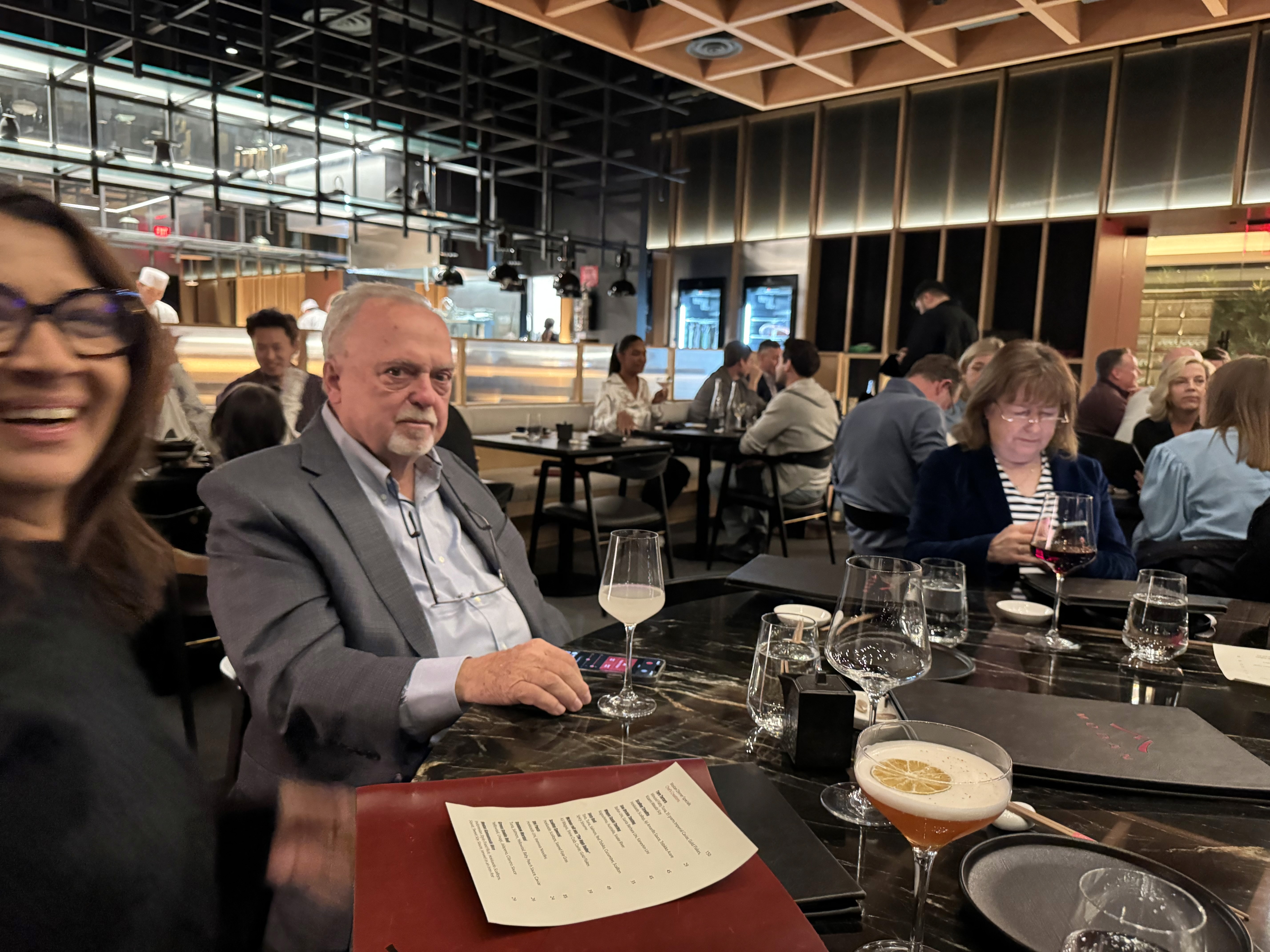 two people in a workspace working on their laptops 