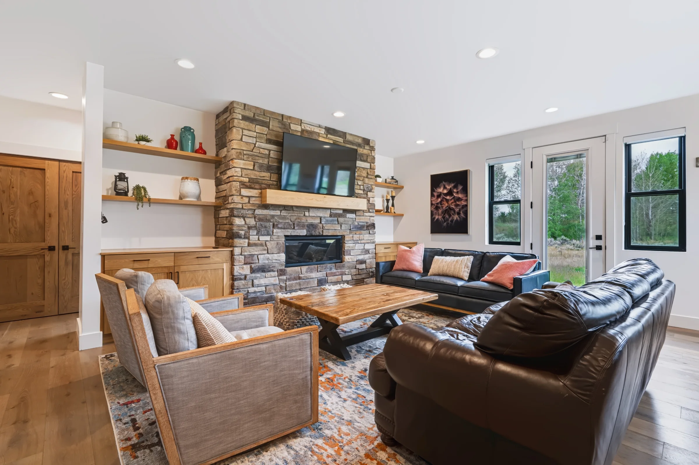 Living room with stone fireplace and timber mantel