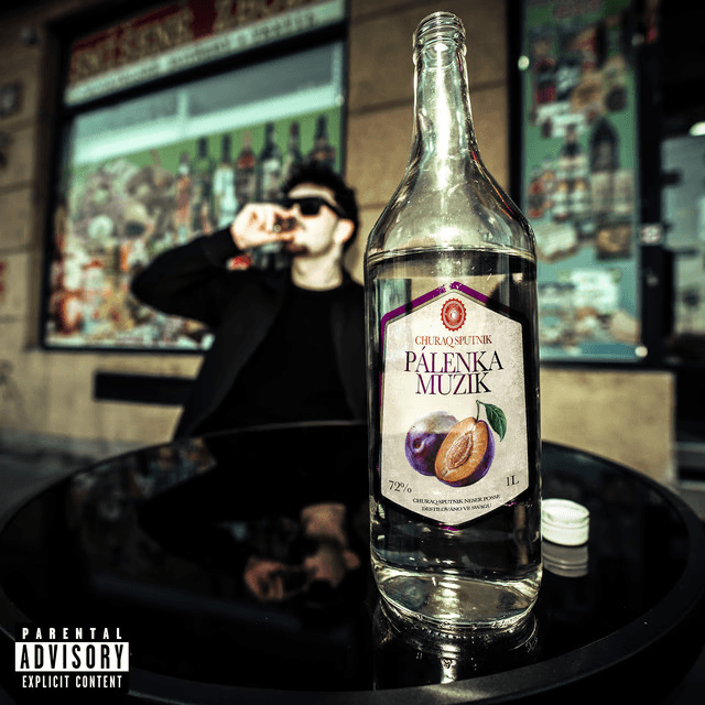 A fast black sports car races down the highway.