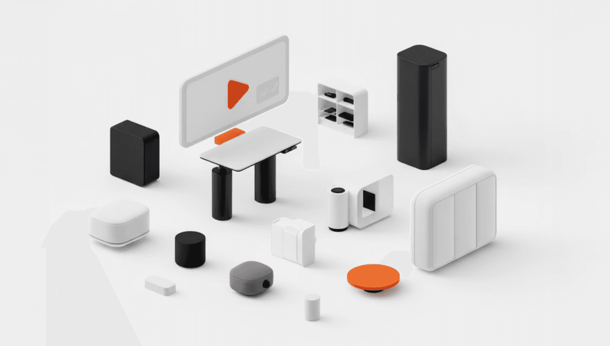 Close-up of a sleek modern electronic device with a magnetic connector and an orange logo on a metallic surface.