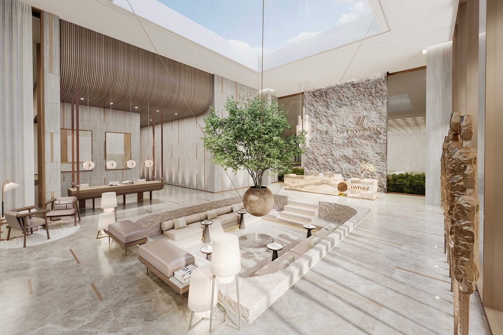 Stylish living room at Wynwood Horizon, equipped with a large television and modern decor elements.