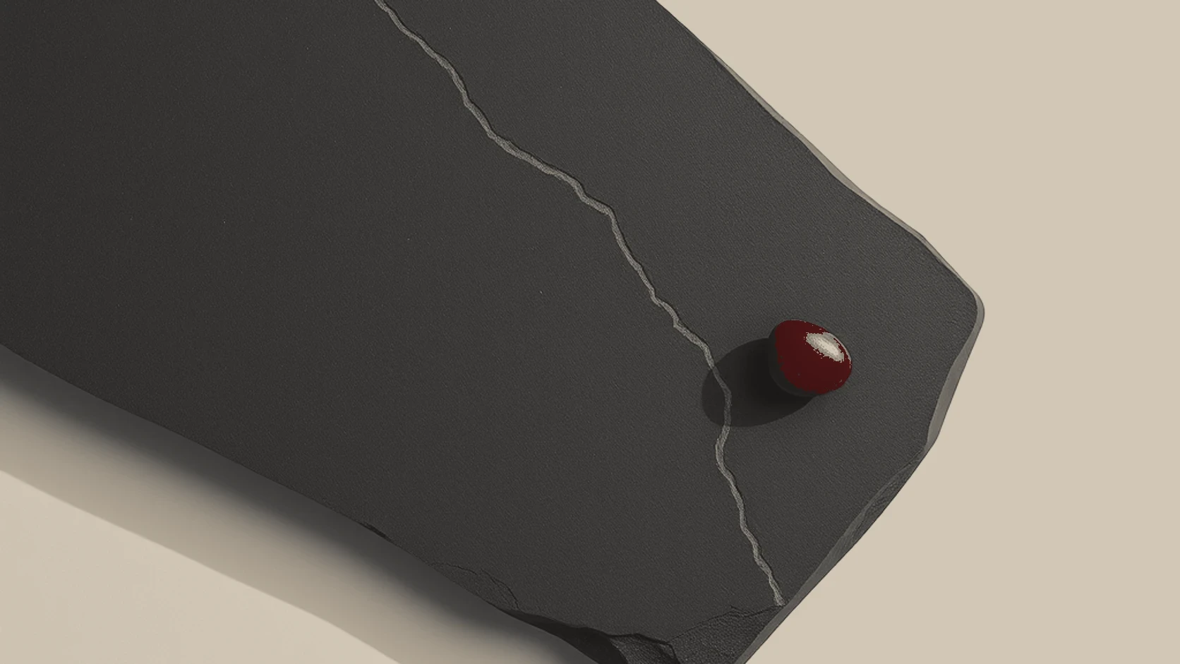 A physical metaphor for the difference between what people say and what they do. The etched path represents the observable trail of past actions, while the small red pebble represents a single stated preference that can easily be moved or misinterpreted.