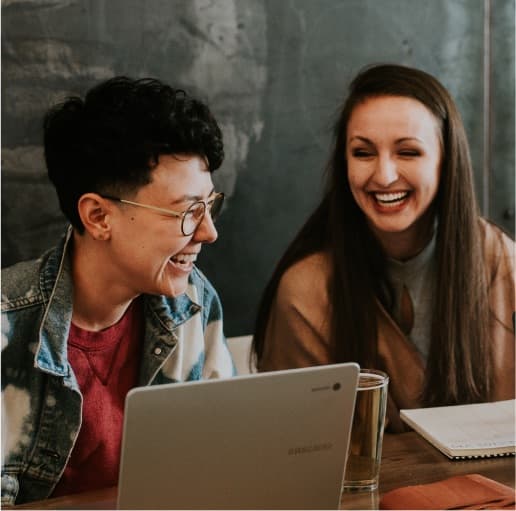 Two female IT experts Conversation having a conversation and laughing.