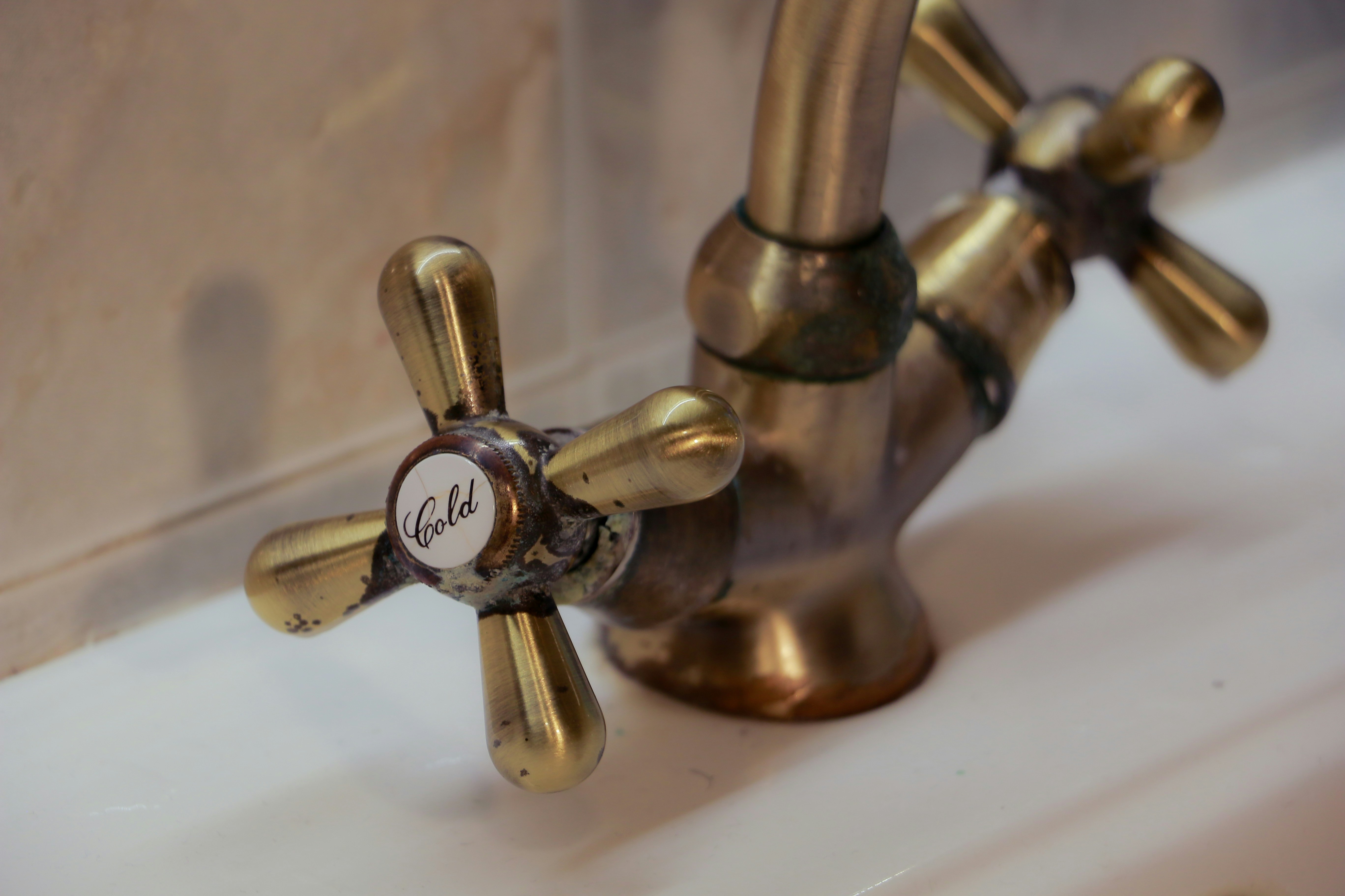 Antique brass faucet with hot and cold handles