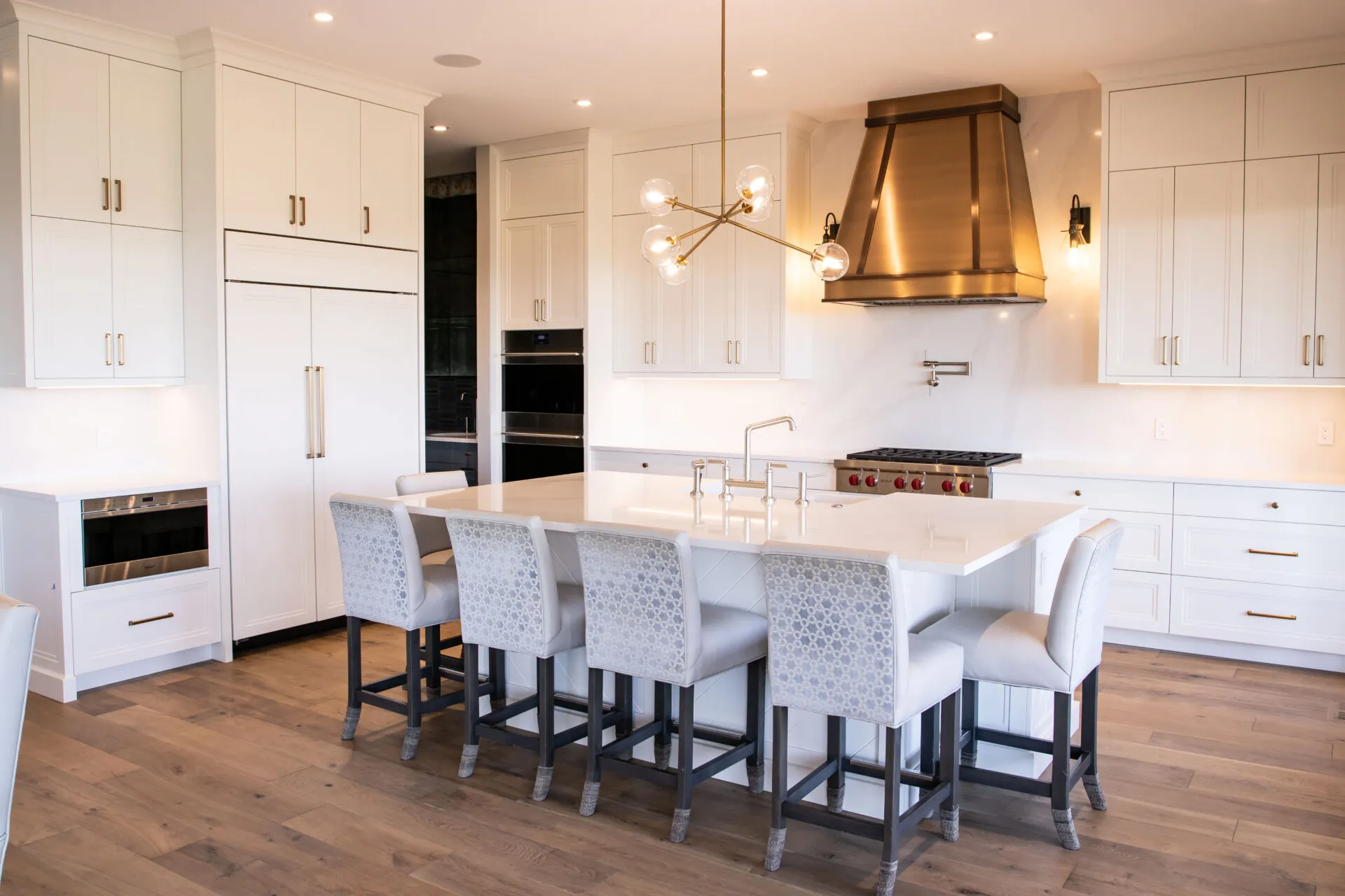 Image of white kitchen with gold accents.