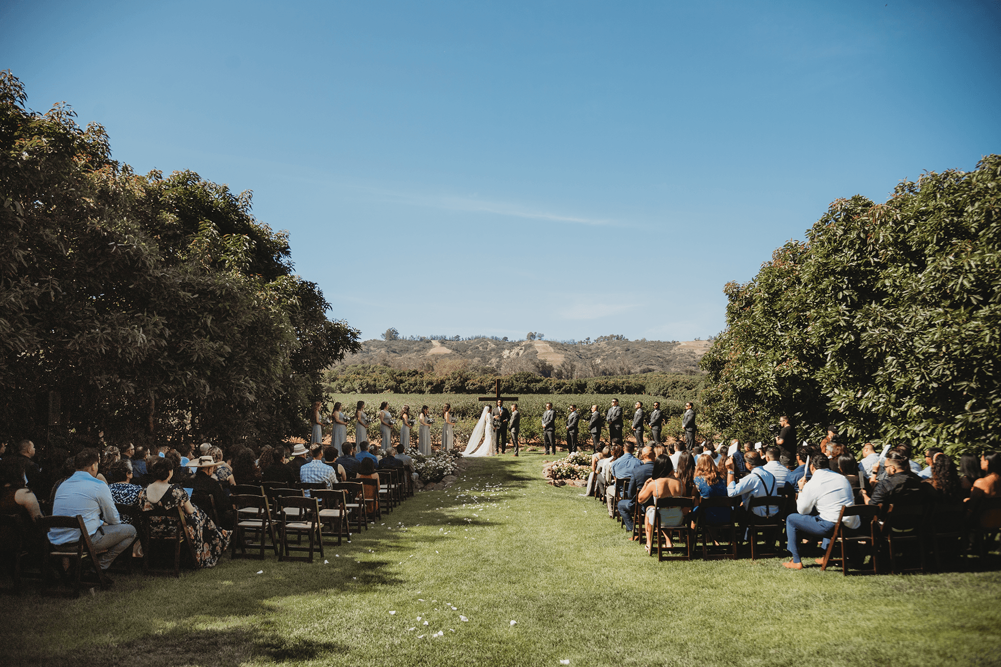 Wedding ceremony wide shot with guests and mountains in Santa Rosa Valley