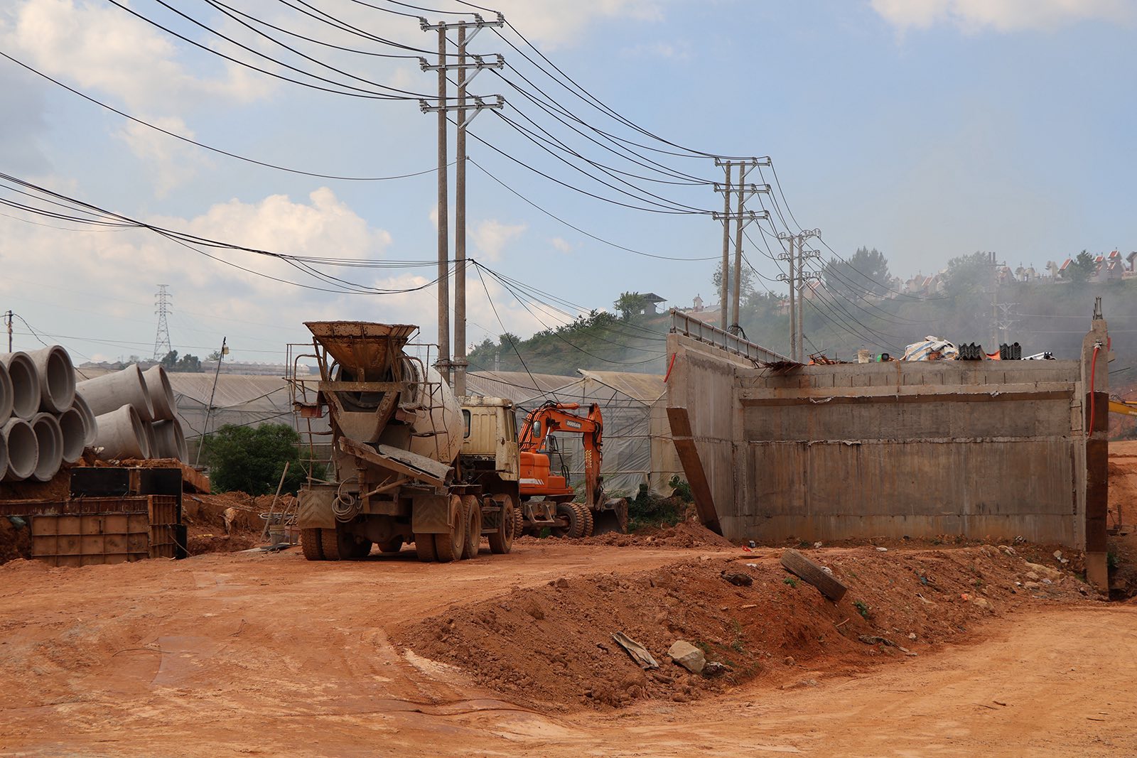 Construction workers review plans on site.
