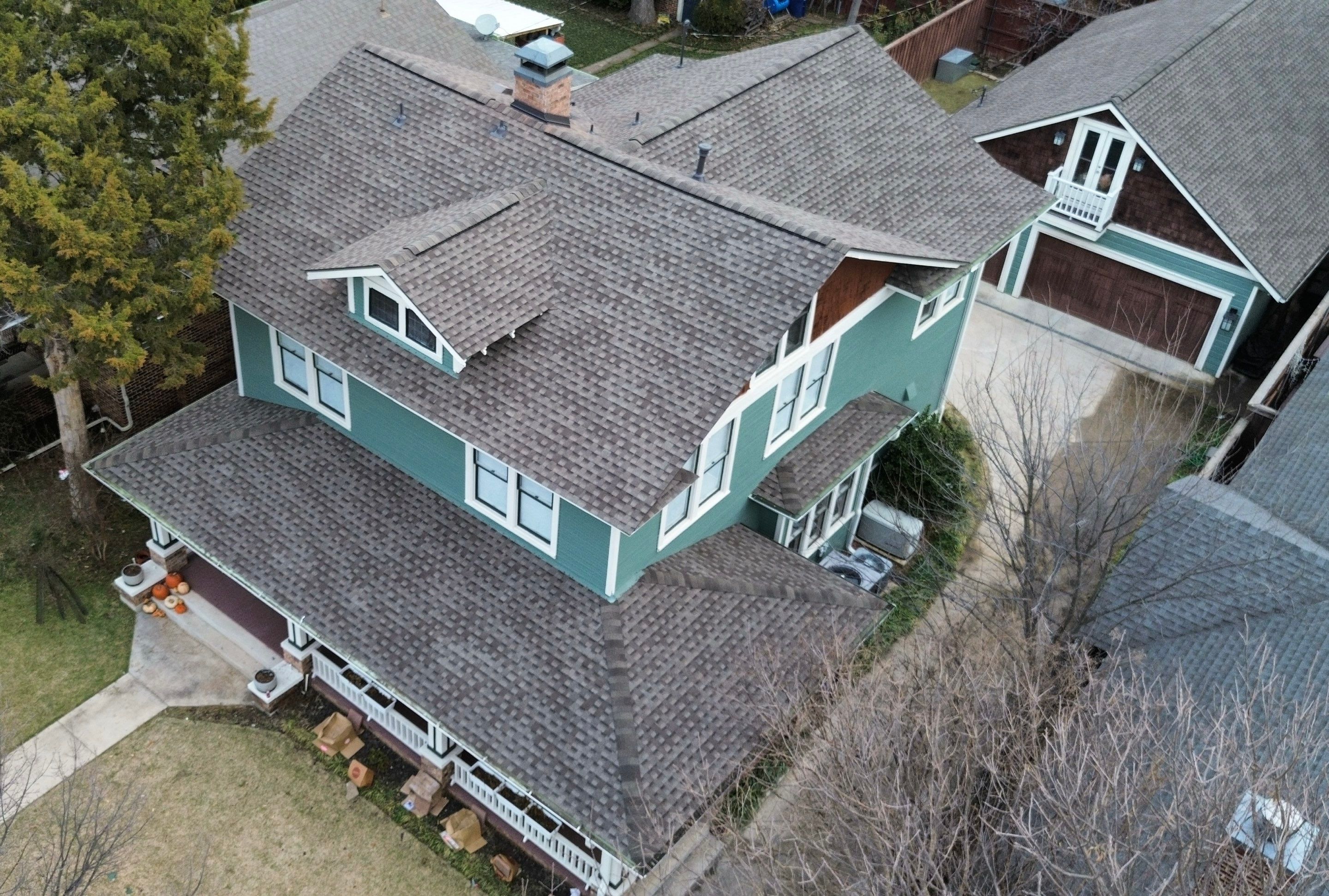 Aerial of a Winnetka Heights craftsman bungalow in Oak Cliff with a new GAF Timberline Armorshield II shingle roof in Weathered Wood