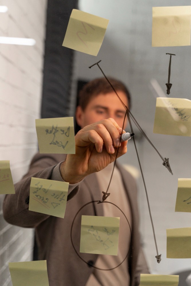 Team leader explaining a large project task and outlining its smaller components