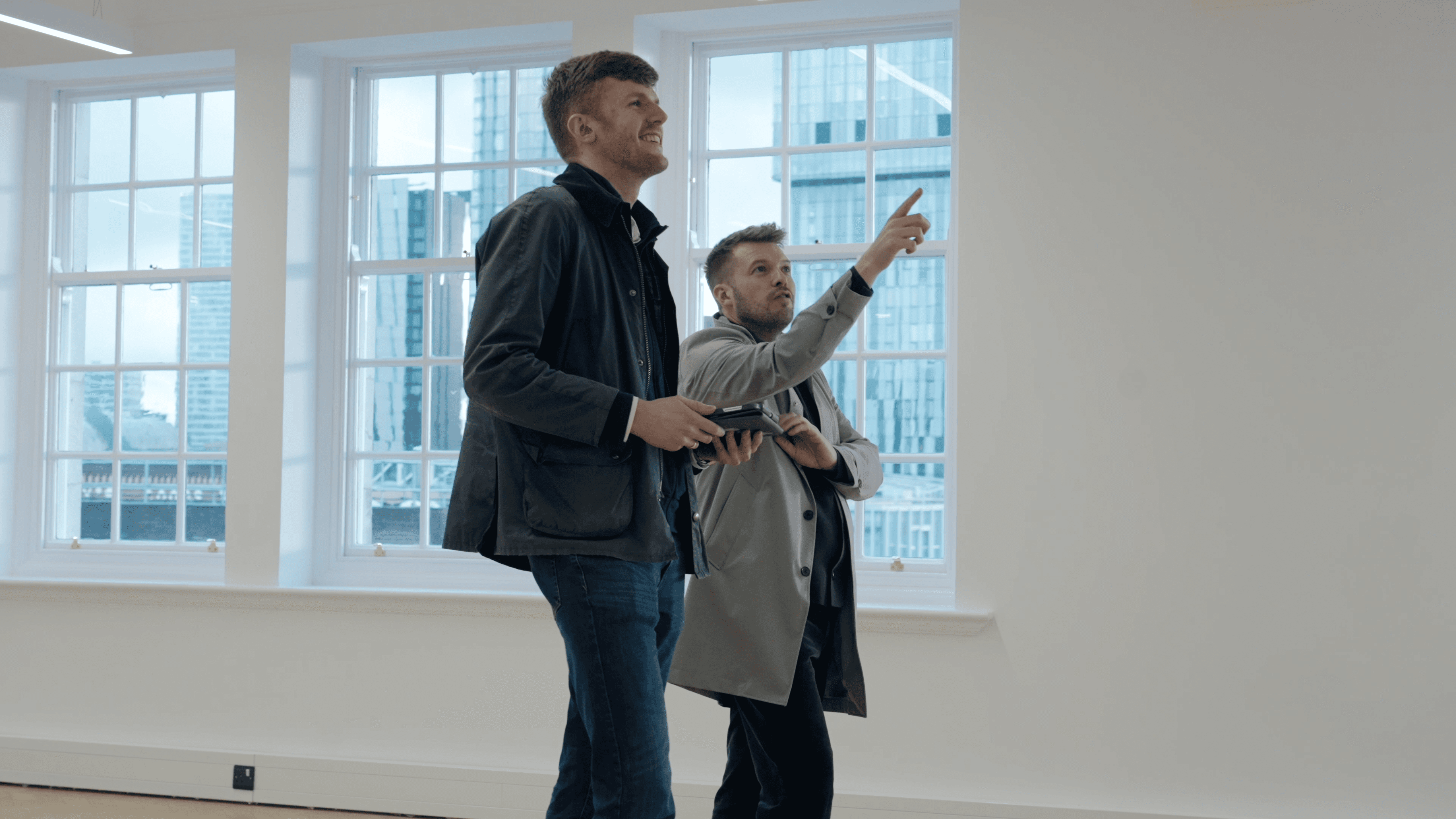 People using laptop and discusing