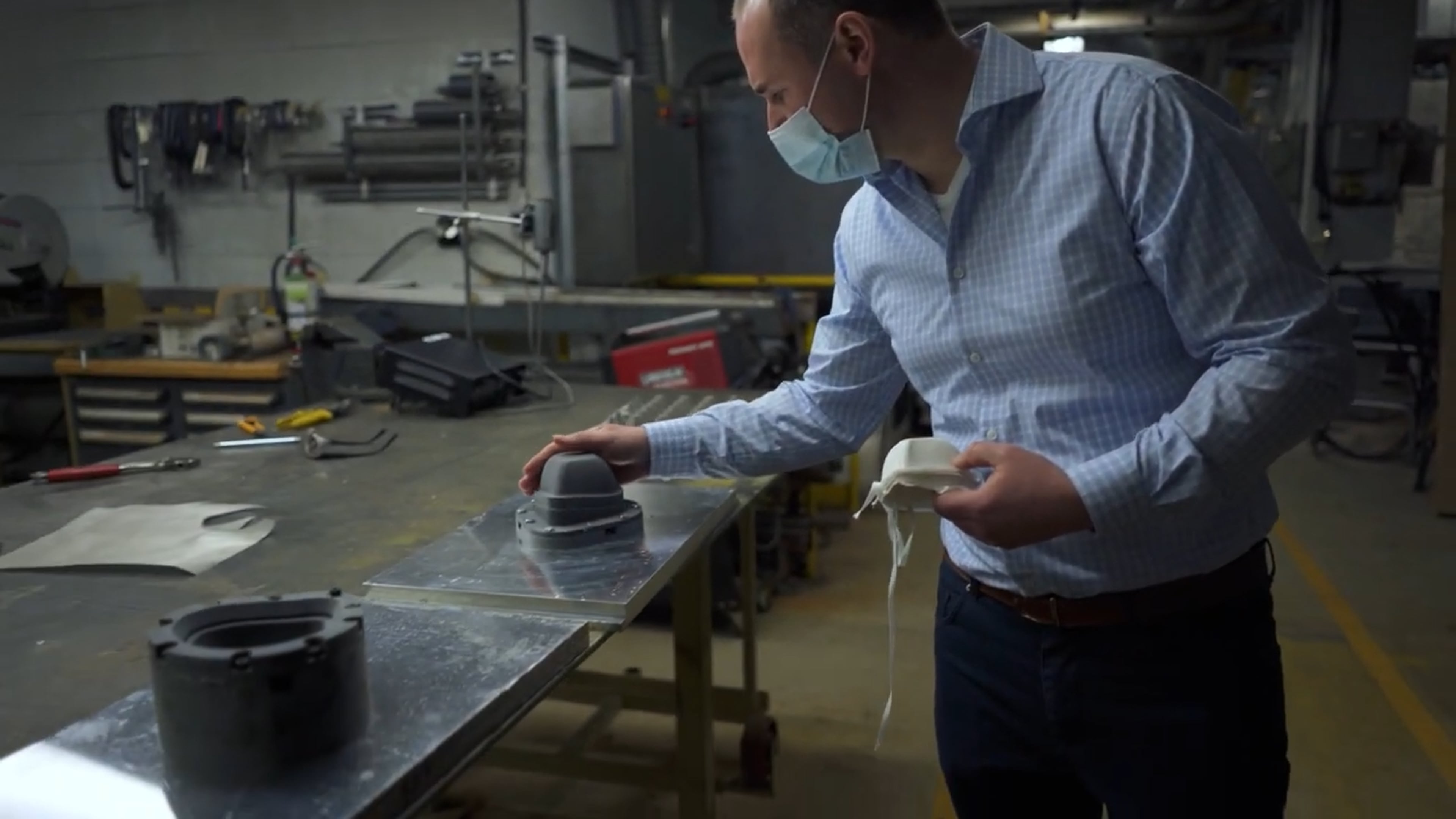 Front cover image for a short film made for HP. The image shows a man looking at a mask template.