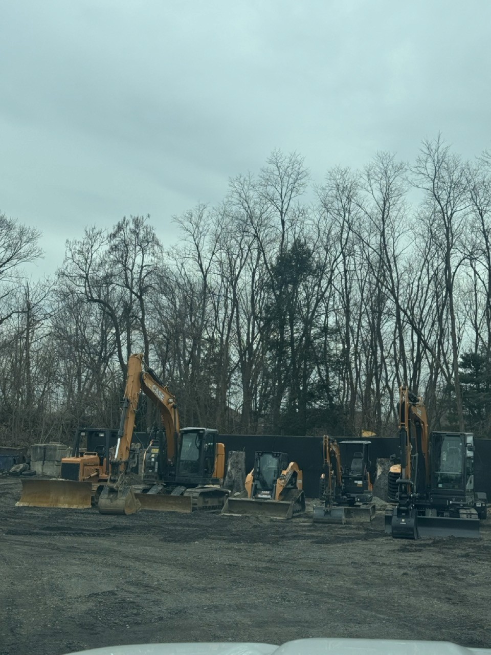 Fleet of CASE machines staged on a cleared site