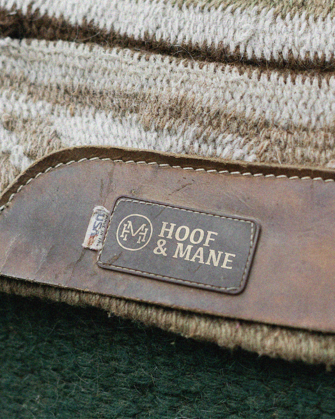 Modern home office setup with a monitor, ergonomic chair, keyboard, and indoor plants near a window with blinds.