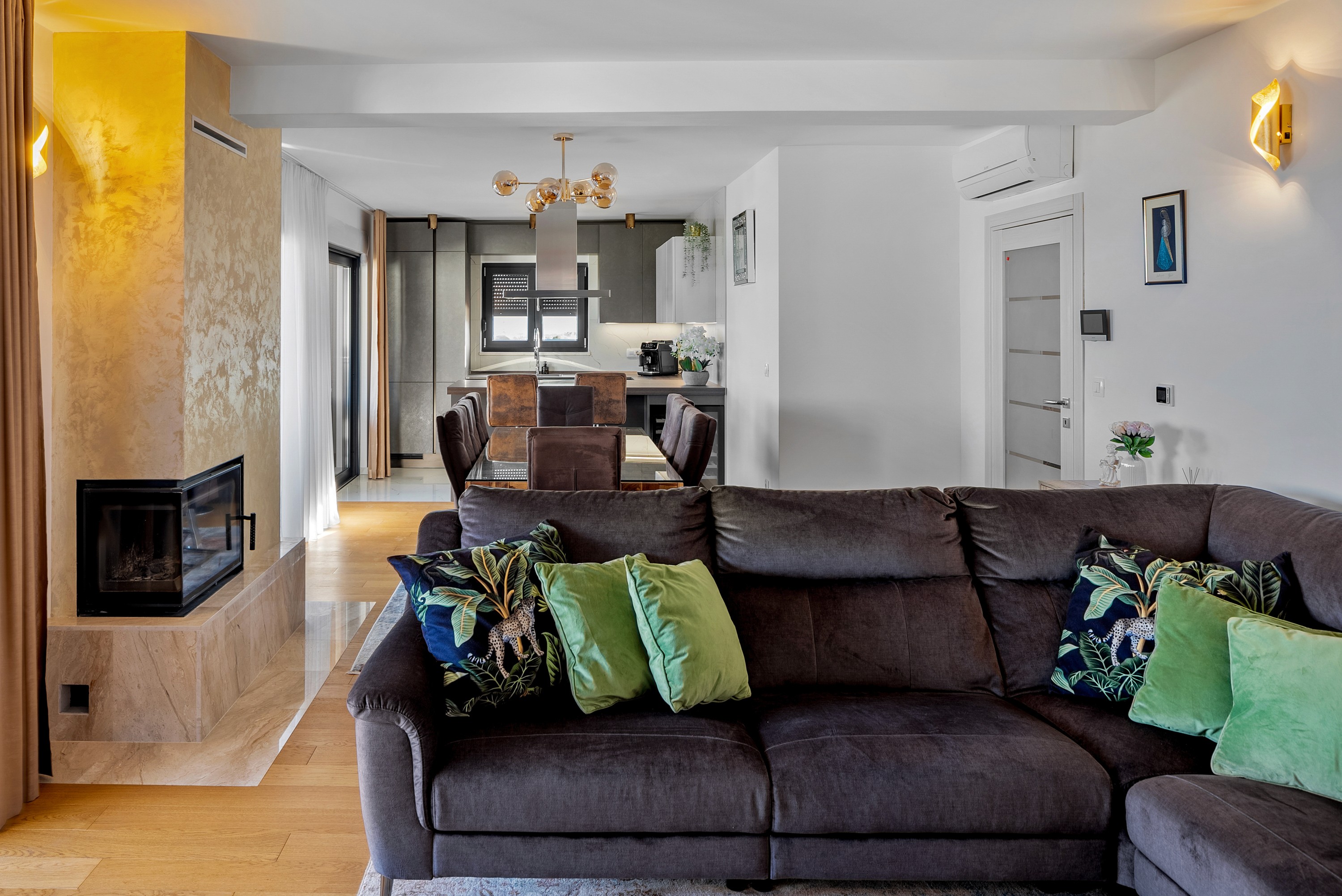 Bedroom with wall bookshelf and mountain view.