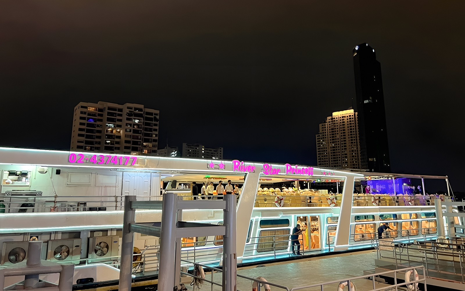 River Star Princess cruise ship docked at night on Chao Phraya River, Bangkok.
