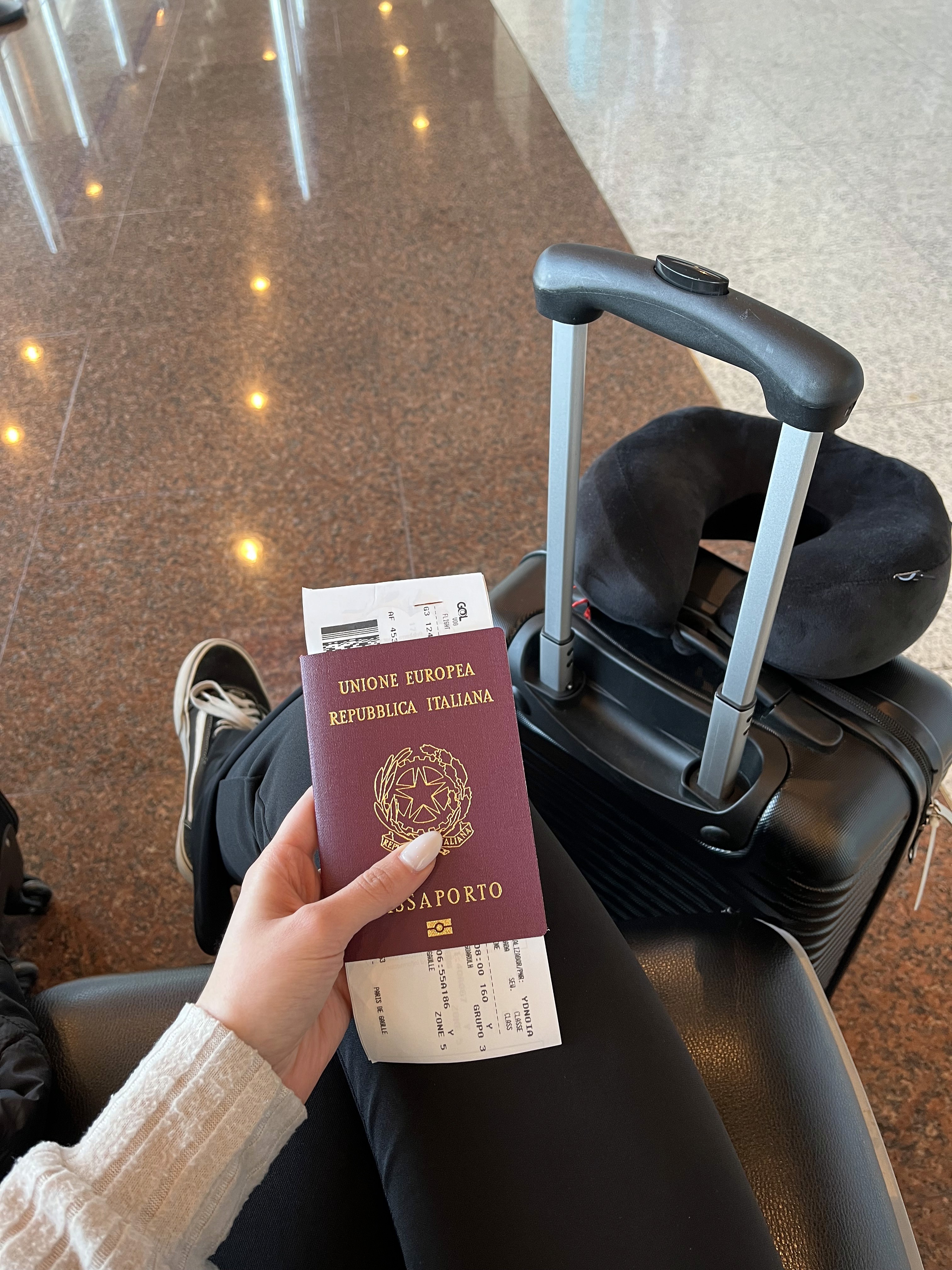 a group of people walking on a sidewalk