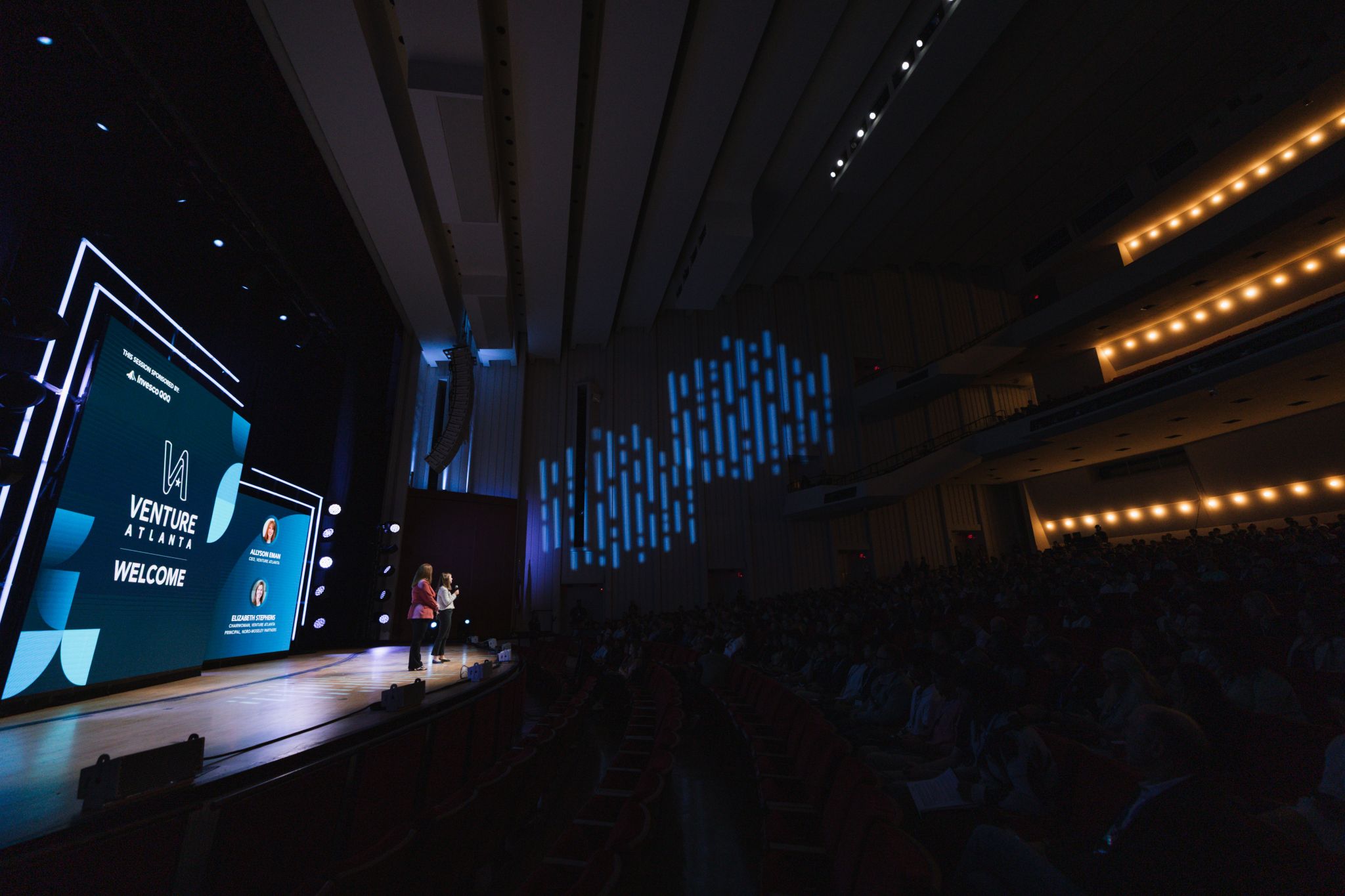 The Hero Experience. Bridging digital design with physical scale to anchor the main stage welcome moments.