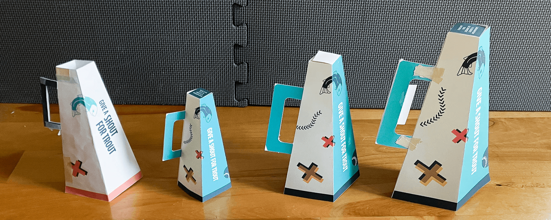 Popcorn holders shaped like four-sided megaphones. Megaphones at four different sizes are displayed.