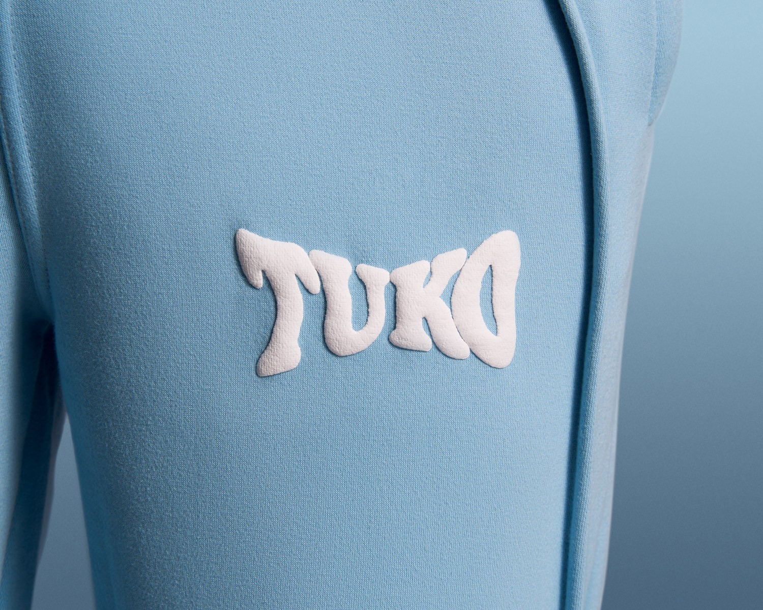 Tuko Clothing blue Dandadan inspired tracksuit detail shot photographer by Matthew Brown (London product photographer).