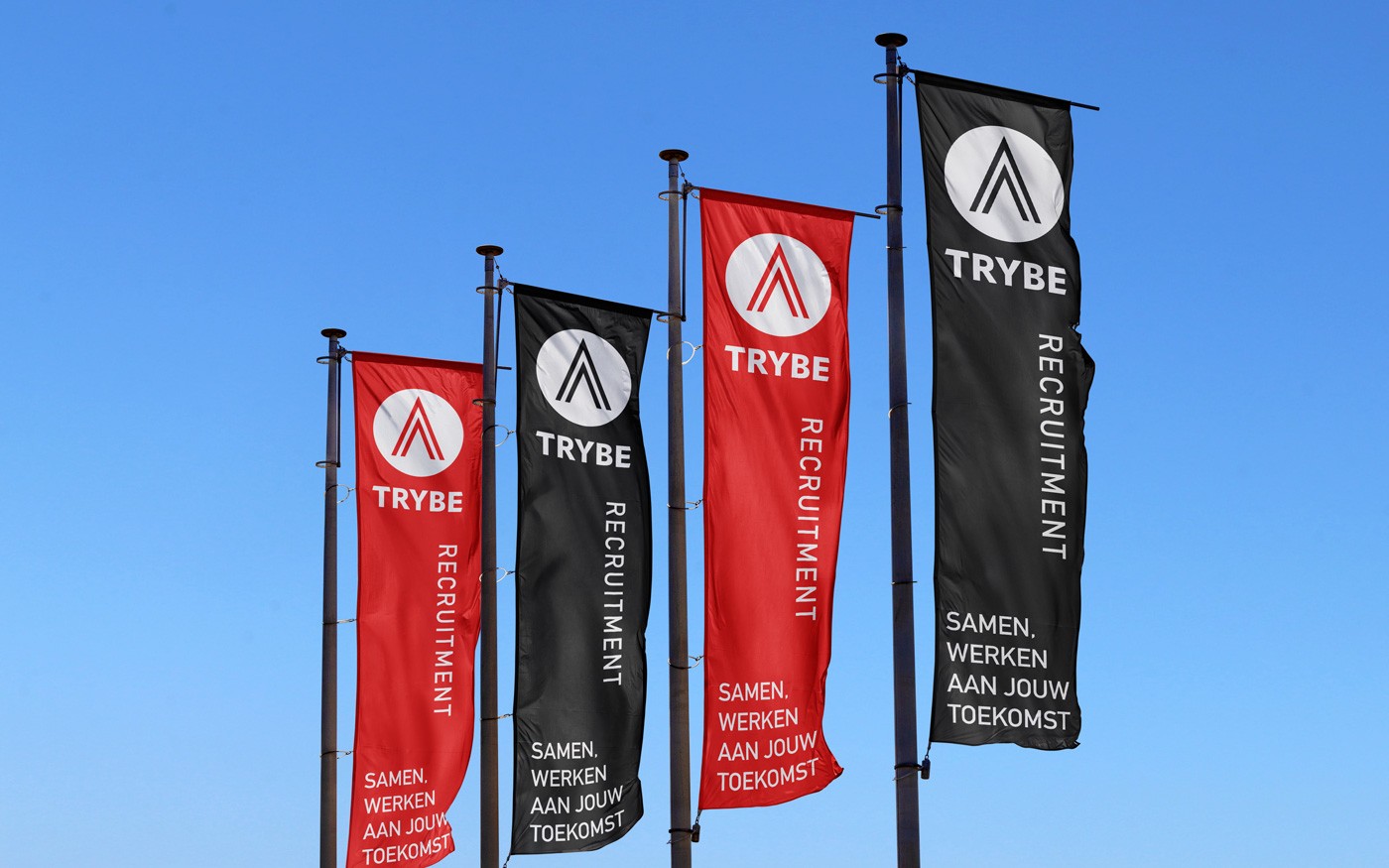 Red and black banner of Trybe Redtuitment against a blue sky