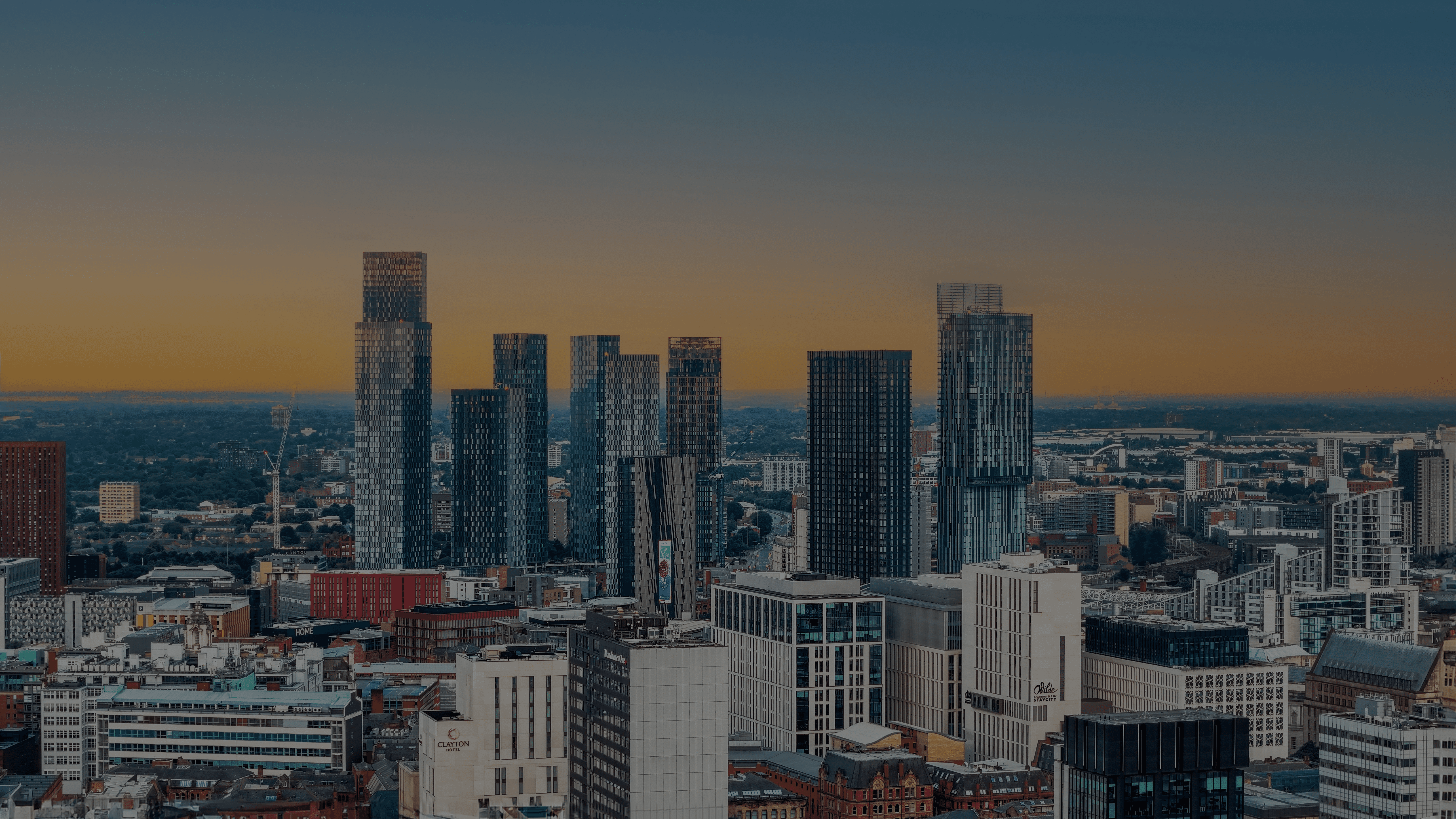 A view of a city from the top of a building